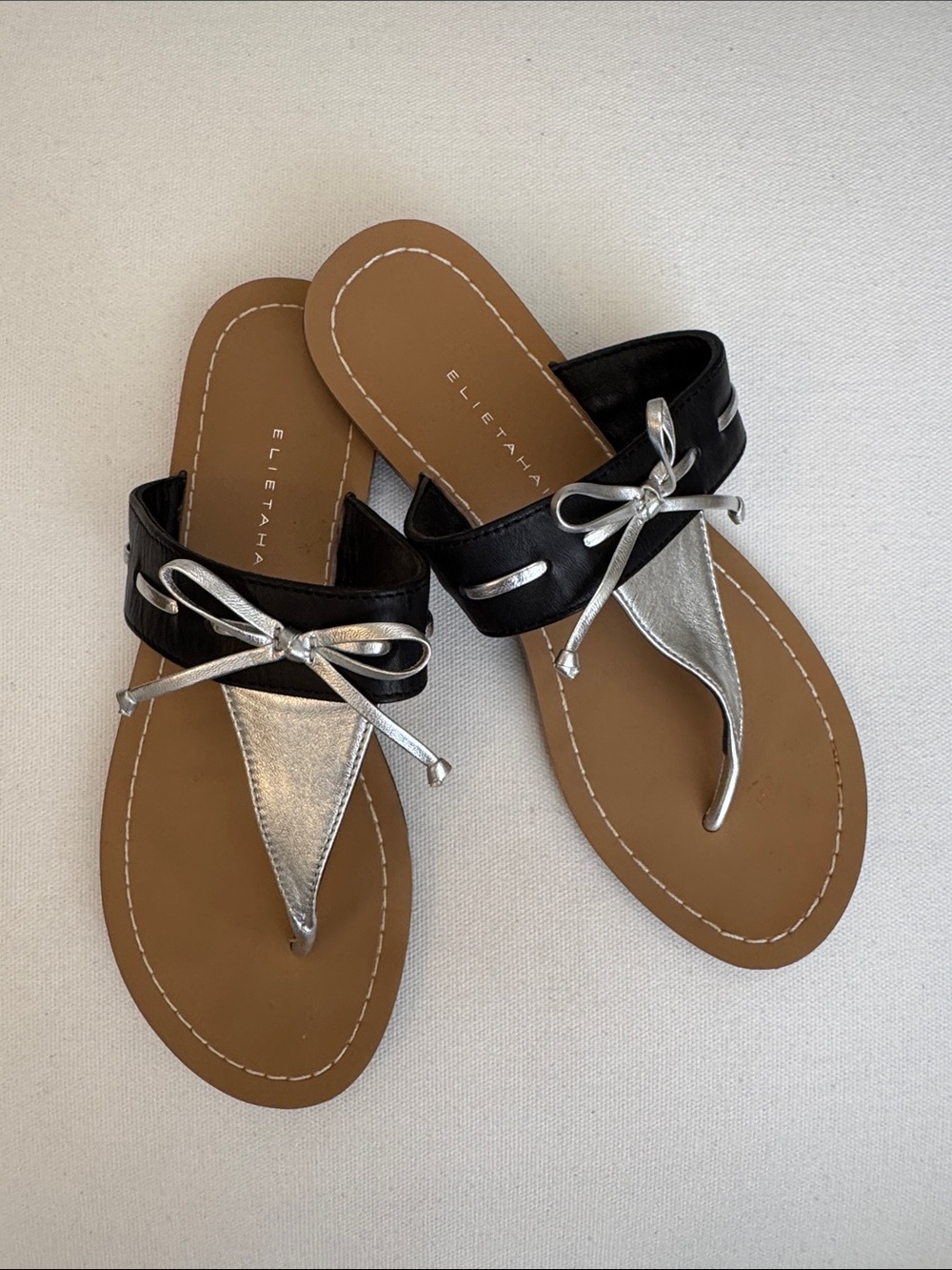 Elie Tahari Black and Metallic Silver Leather Bow Thong Flat Slide Sandals